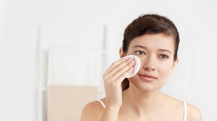 Bioderma - woman cleansing her face